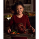 Food stylist Janice Poon holds a Peking Duck Hannibal head. (Photo: Titan Books/Brilynn Ferguson)